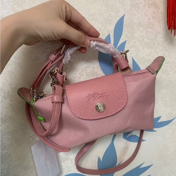 Longchamp Handbags - Longchamp Pink Mini Leather & Nylon Crossbody Bag